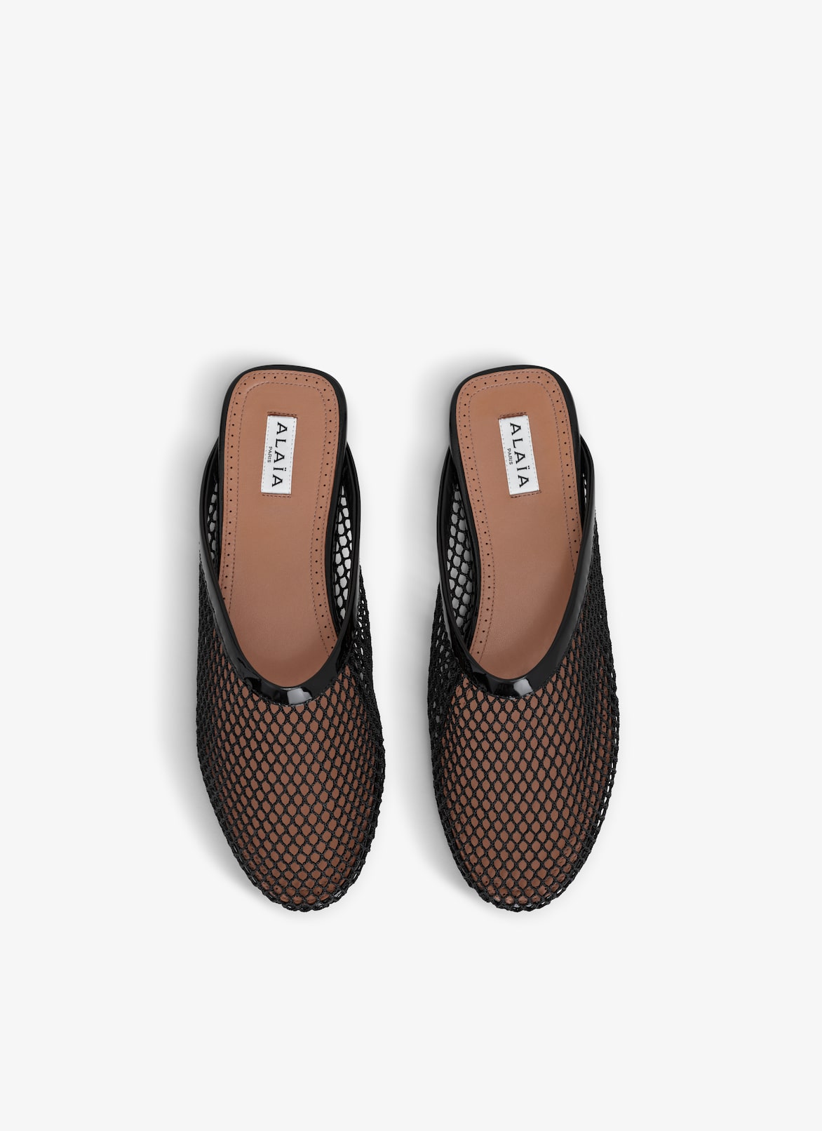 MULES PLATES EN RÉSILLE ALAÏA NOIR MULES PLATES EN RÉSILLE